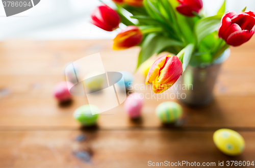 Image of close up of easter eggs and flowers in bucket