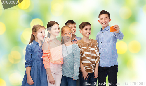 Image of happy children talking selfie by smartphone