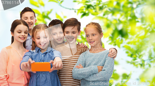 Image of happy children talking selfie by smartphone