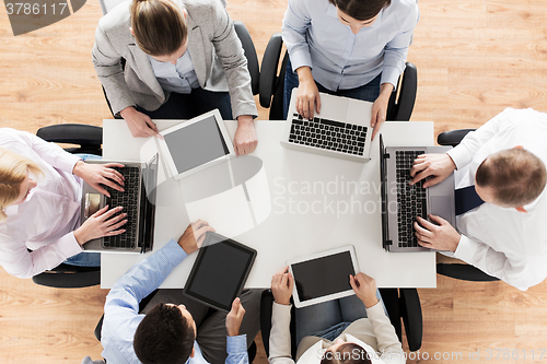 Image of business team with laptop and tablet pc