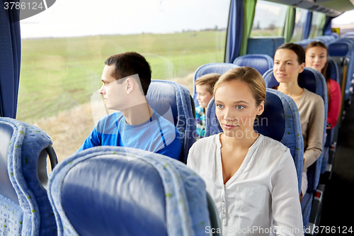 Image of group of passengers or tourists in travel bus