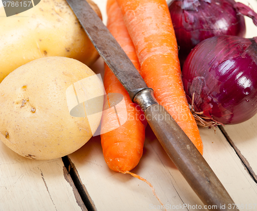 Image of basic vegetable ingredients carrot potato onion 