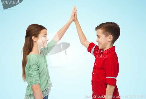 Image of happy boy and girl making high five