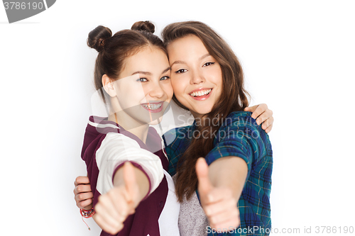 Image of happy smiling teenage girls showing thumbs up