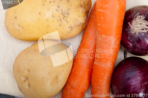 Image of basic vegetable ingredients carrot potato onion 