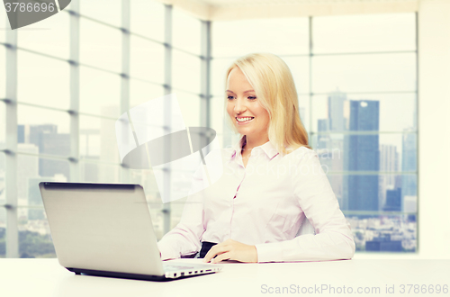 Image of smiling businesswoman or student with laptop