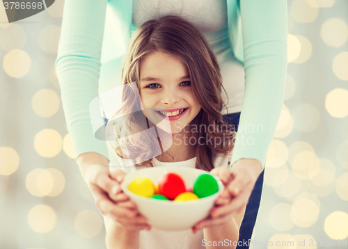 Image of close up of happy family holding easter eggs