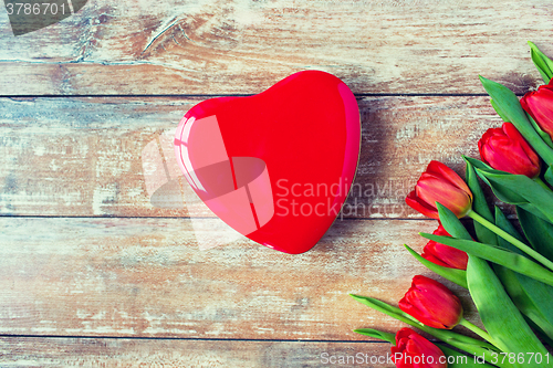 Image of close up of red tulips and chocolate box