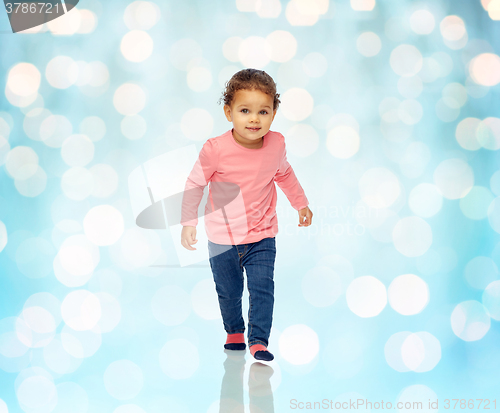 Image of beautiful little baby girl walking