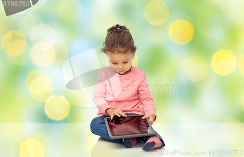 Image of little baby girl playing with tablet pc computer