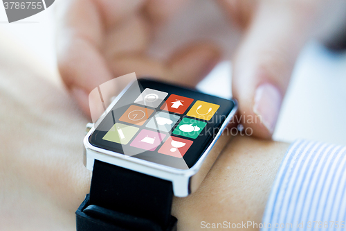 Image of close up of hands setting smart watch application