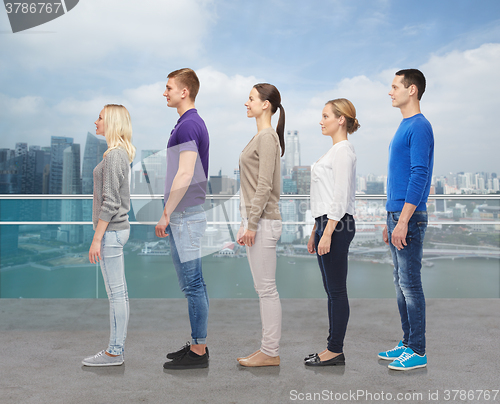 Image of group of people over city waterside background