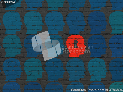 Image of Finance concept: head with keyhole icon on wall background