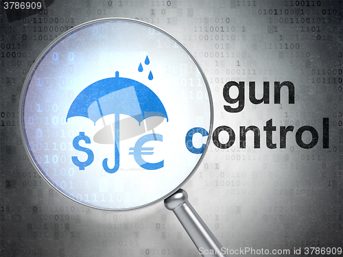 Image of Security concept: Money And Umbrella and Gun Control with optical glass