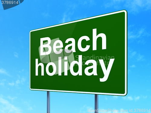 Image of Vacation concept: Beach Holiday on road sign background