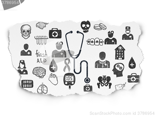 Image of Healthcare concept: Stethoscope on Torn Paper background
