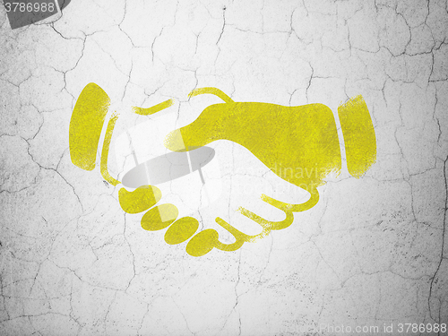 Image of Finance concept: Handshake on wall background