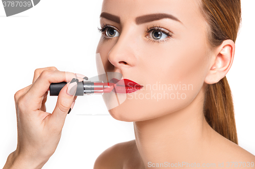 Image of Beautiful female lips with make-up and brush