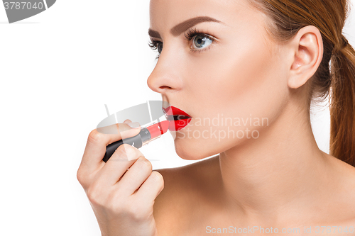 Image of Beautiful female lips with make-up and pomade