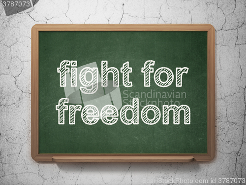 Image of Political concept: Fight For Freedom on chalkboard background