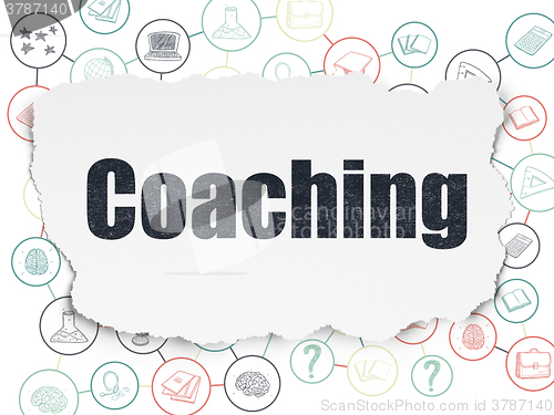 Image of Learning concept: Coaching on Torn Paper background