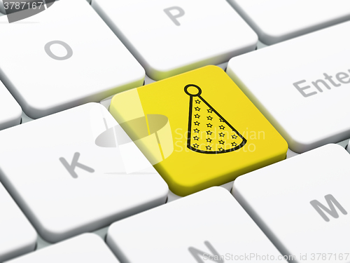 Image of Entertainment, concept: Party Hat on computer keyboard background