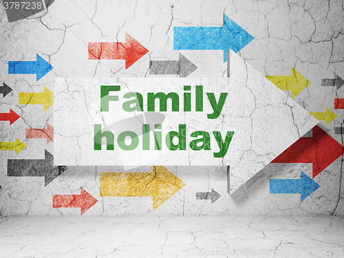 Image of Vacation concept: arrow with Family Holiday on grunge wall background