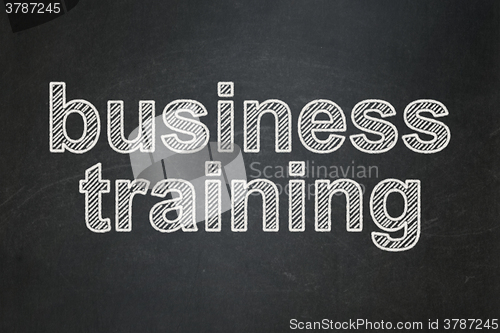 Image of Education concept: Business Training on chalkboard background