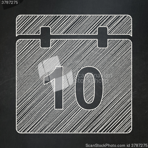 Image of Time concept: Calendar on chalkboard background