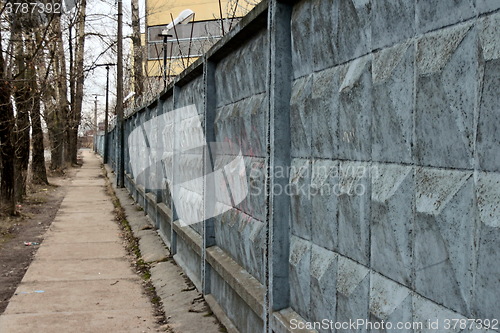 Image of  dreary road along the prison wall