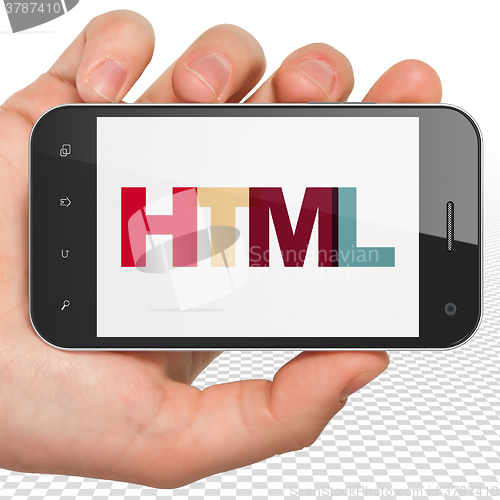 Image of Database concept: Hand Holding Smartphone with Html on  display