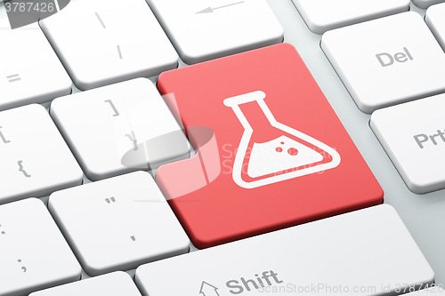 Image of Science concept: Flask on computer keyboard background