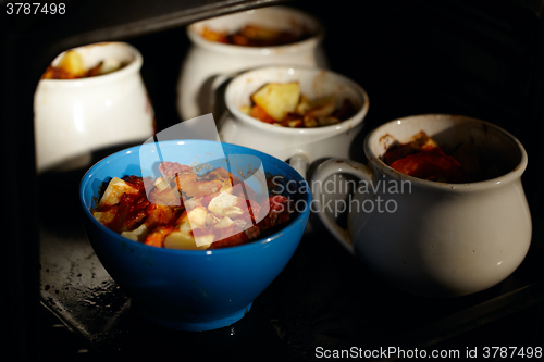 Image of Mutton meat and potatoes, baked in pot.