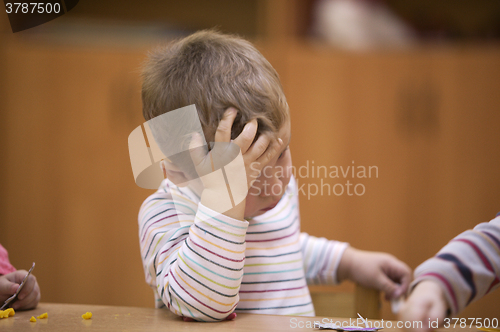 Image of Cute little child in kindergarten class