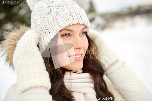 Image of happy woman outdoors in winter