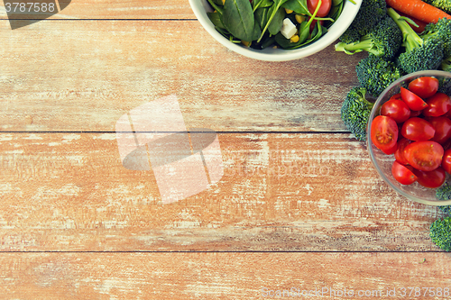 Image of close up of ripe vegetables on wooden table