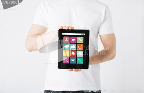 Image of close up of man with app icons on tablet pc