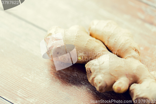 Image of close up of ginger root on wooden table