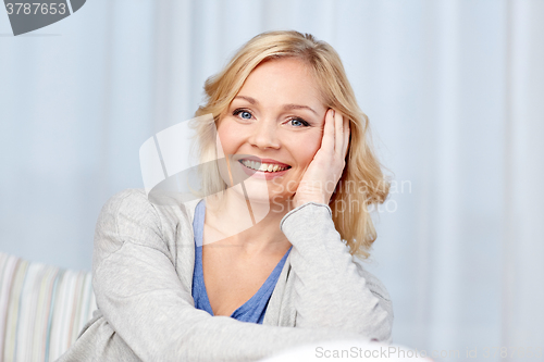 Image of happy middle aged woman at home