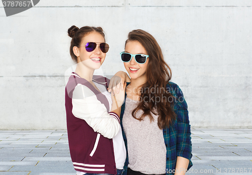 Image of happy smiling pretty teenage girls in sunglasses