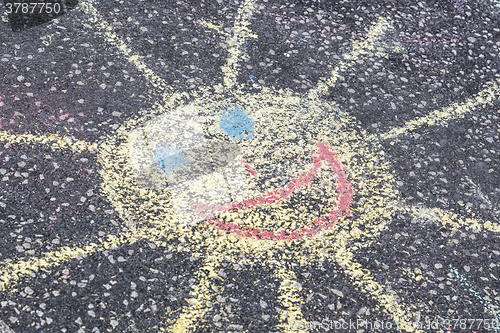 Image of sun on pavement