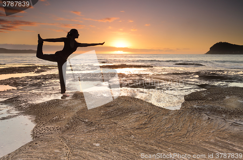 Image of Yoga King Dancer Pose balance by the sea