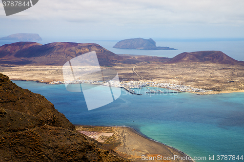 Image of miramar del rio harbor   cloud beach      in lanzarote spain gra