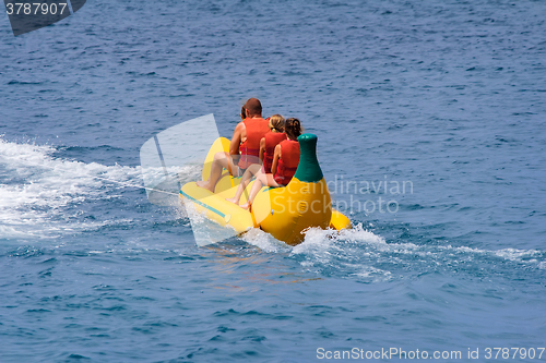 Image of Walking on the sea on an inflatable mattress original shape.