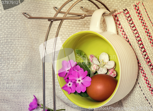 Image of Easter egg, violets and Apple blossoms.