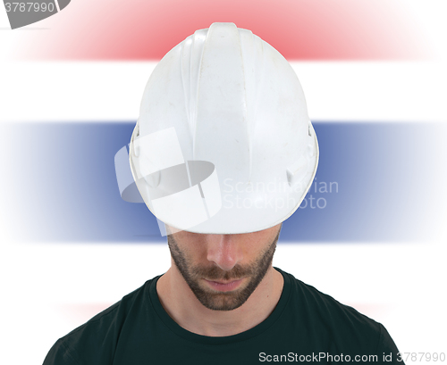 Image of Engineer with flag on background - Thailand