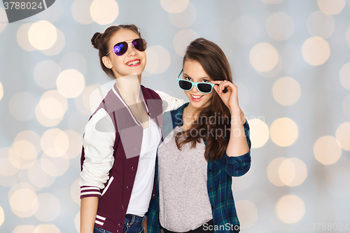 Image of happy smiling pretty teenage girls in sunglasses