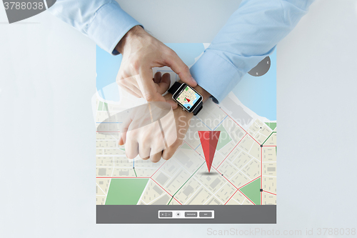 Image of hands with gps navigator map on smart watch