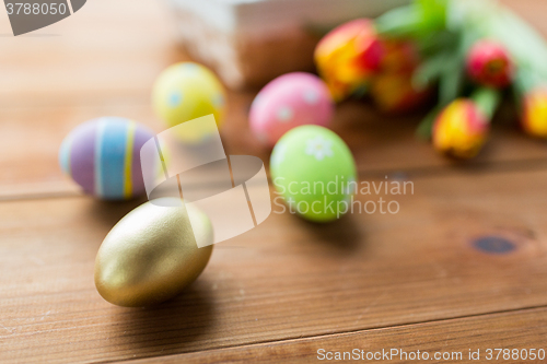 Image of close up of colored easter eggs and flowers