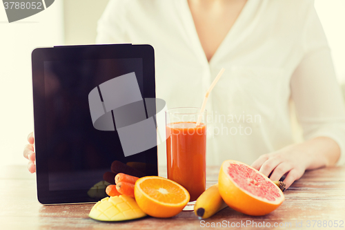 Image of close up of woman hands with juice and fruits